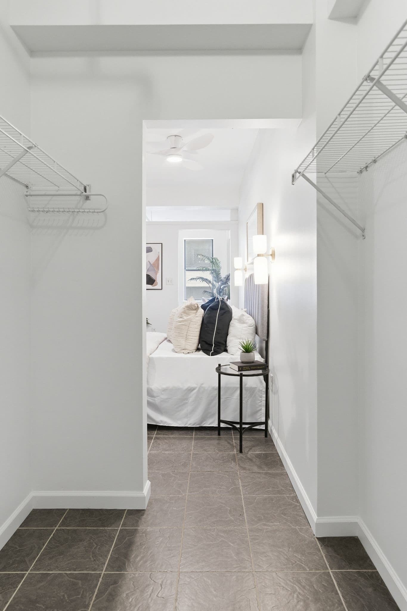 View from a closet into a bedroom with newly painted walls and ceiling