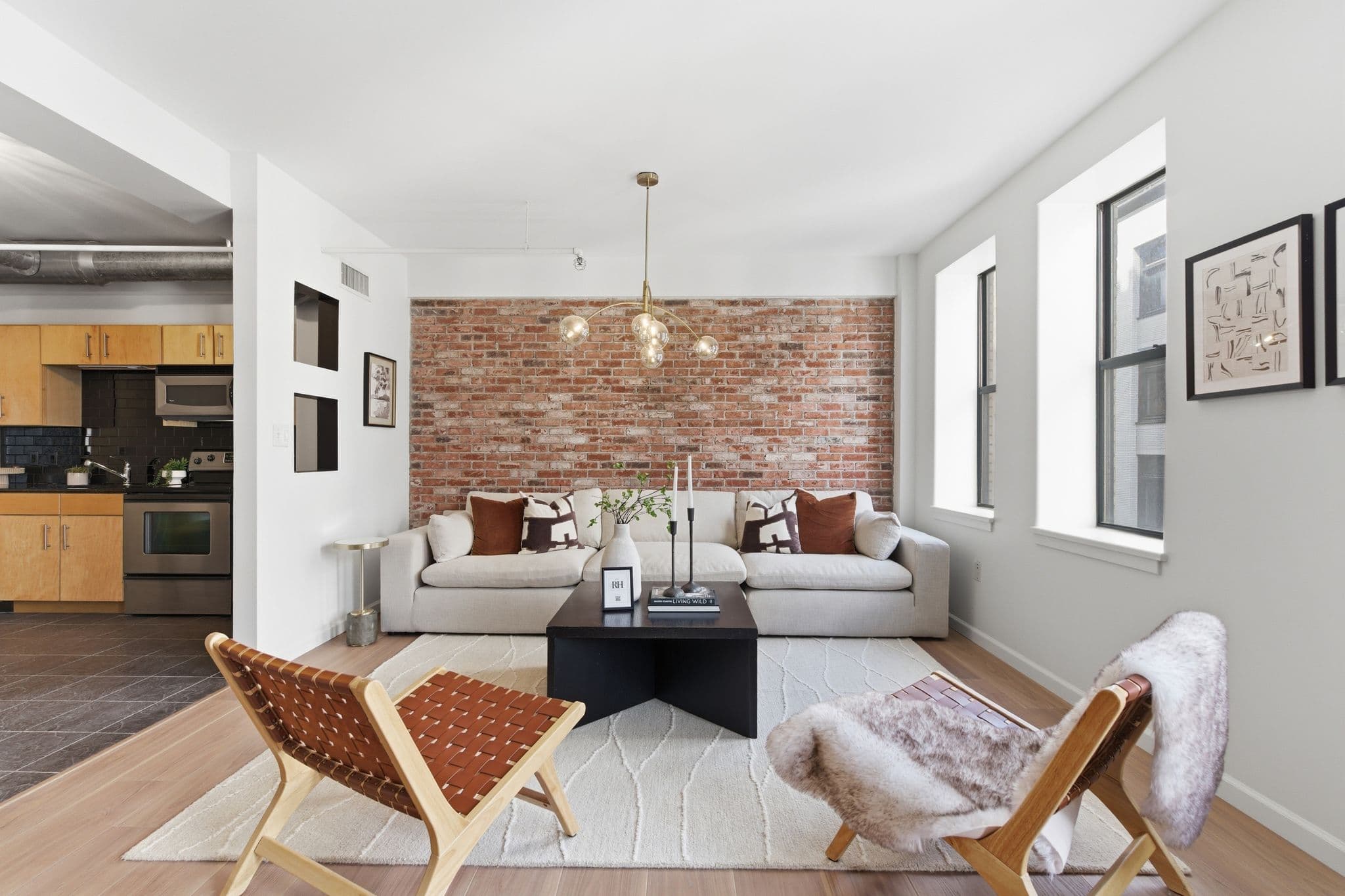 Wide-angle loft living room and kitchen painted by Walsh Painting in Nashville